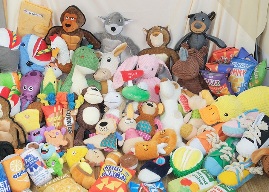 A collage of popular pet toys like plush squeaky toys, rope tugs, and catnip mice.
