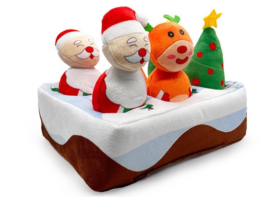 A display of Christmas-themed pet toys, like reindeer and snowman plushies.