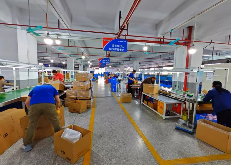 A view of a busy but organized pet toy factory floor