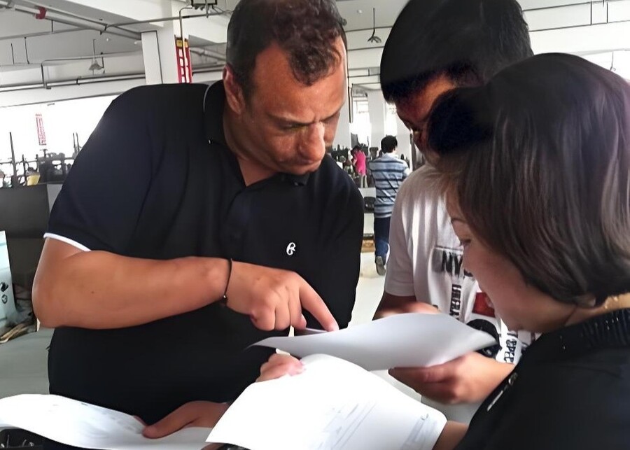 A business owner reviewing different product options with a manufacturing partner