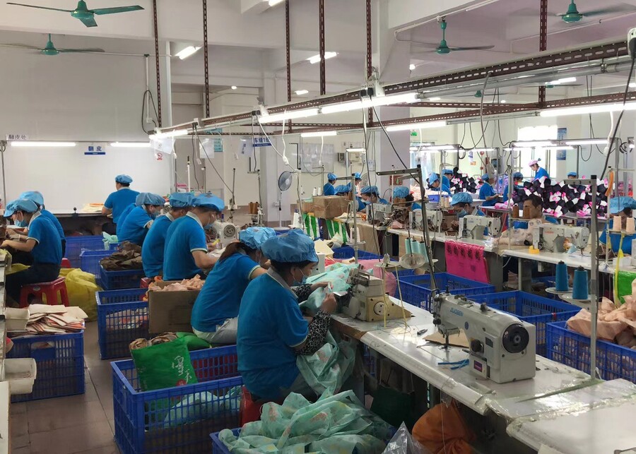 Preeminent's plush pet toy factory floor with workers manufacturing custom OEM/ODM products.