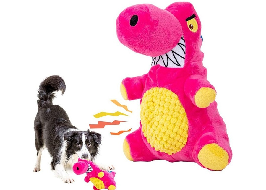 A dog excitedly biting down on a squeaky toy