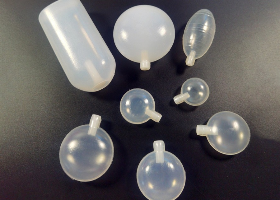 An assortment of different types of dog toy squeakers