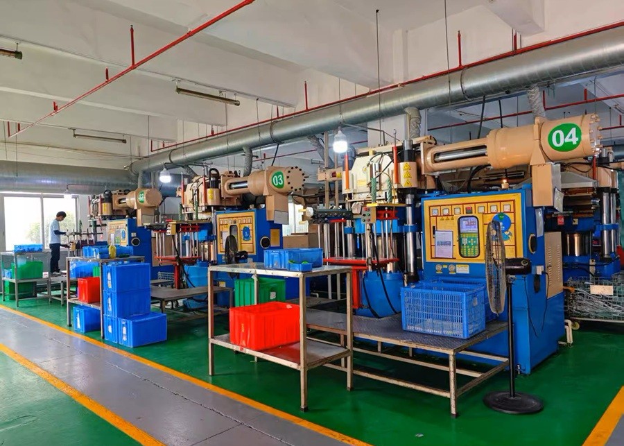 A factory floor with injection molding machines for pet toys