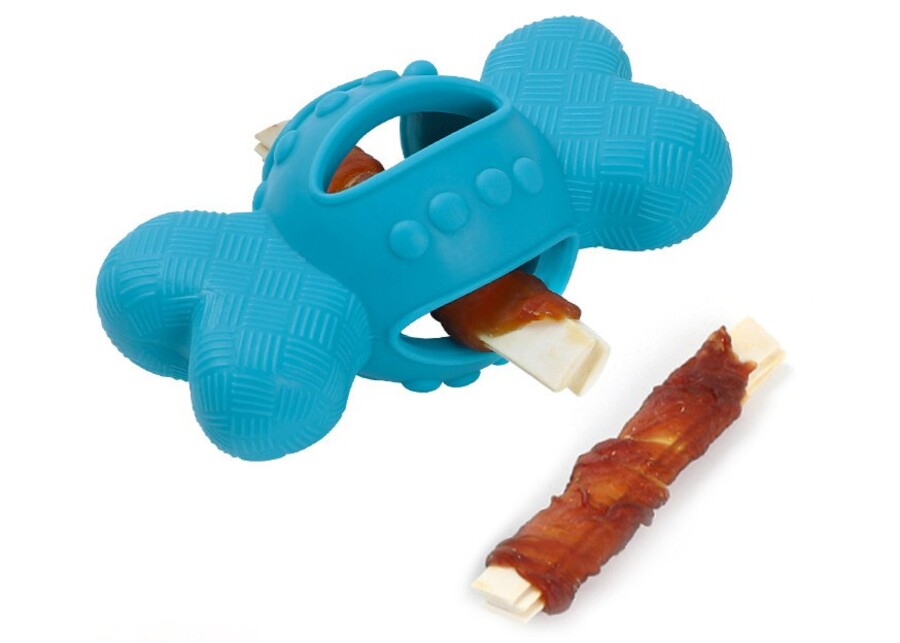 Blue bone-shaped TPR dog toy, an interactive treat dispenser for wholesale pet supplies.