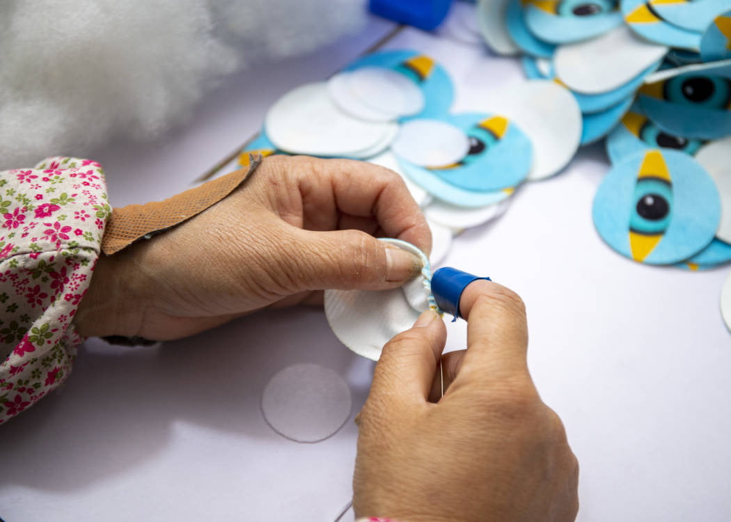 Automated assembly line for dog toy production