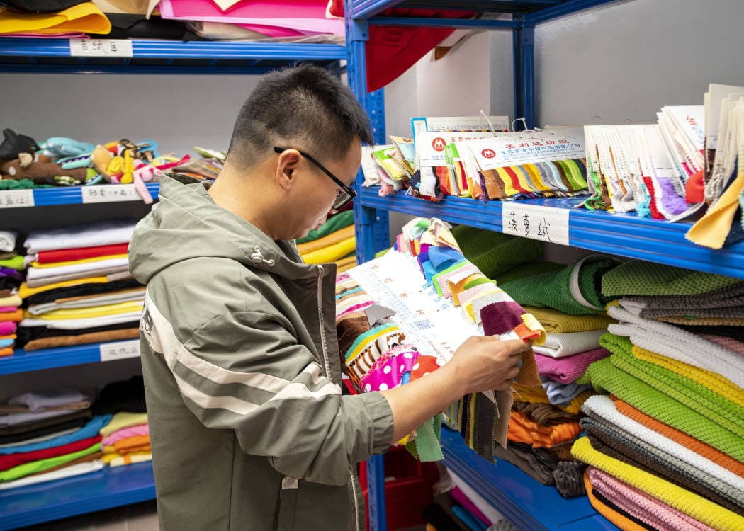 Precision fabric cutting workshop for dog toy manufacturing