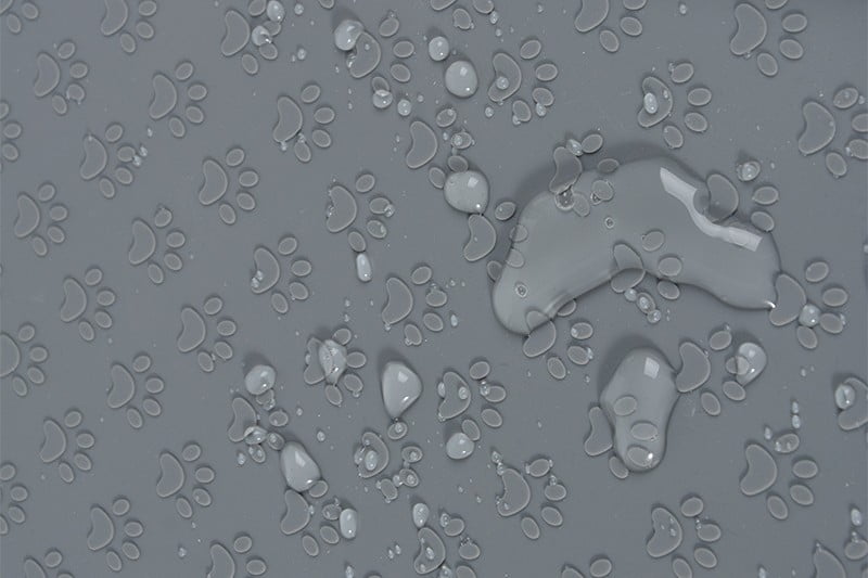 Close up of silicone pet placemat textures including diamond and monogram patterns