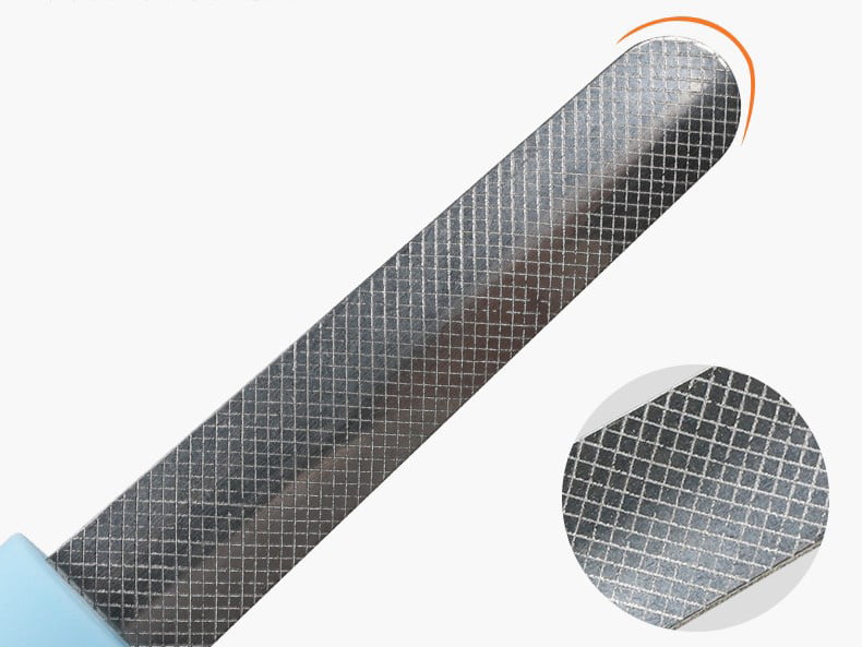 Close-up of curved pet nail file smoothing a dog's claw