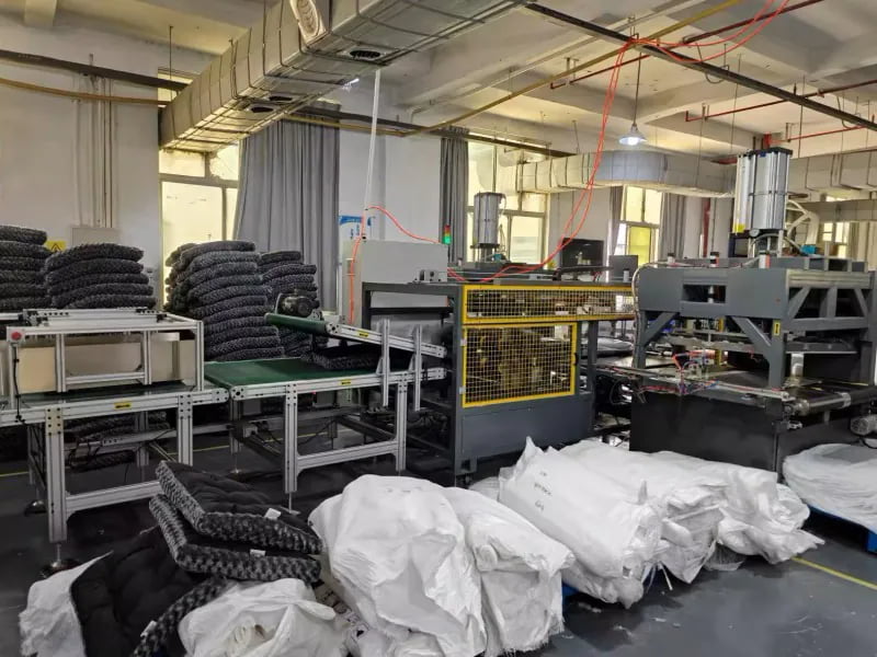 Compression packaging line for pet beds and soft pet goods