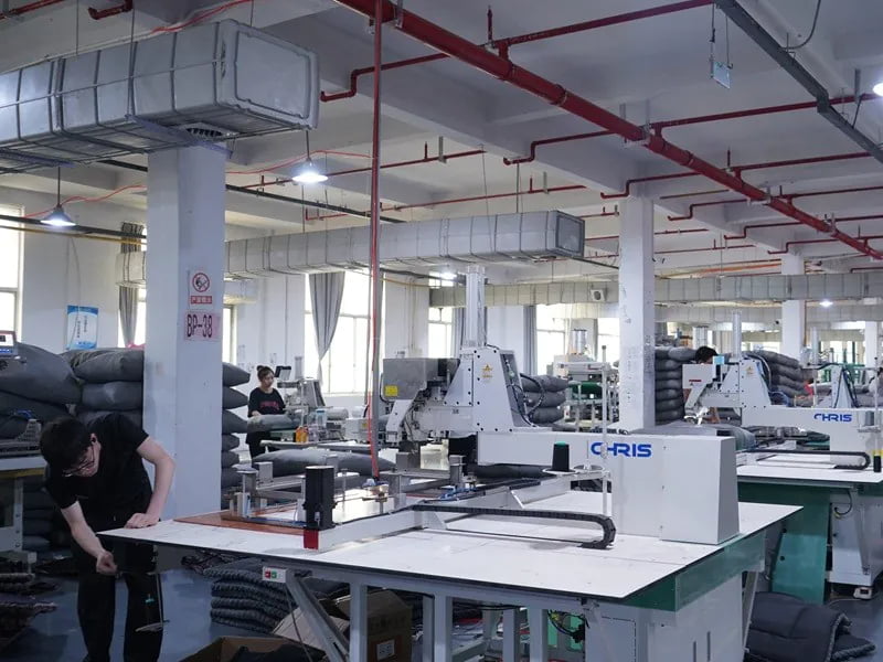 Quilting and sewing machines in a pet bed production workshop