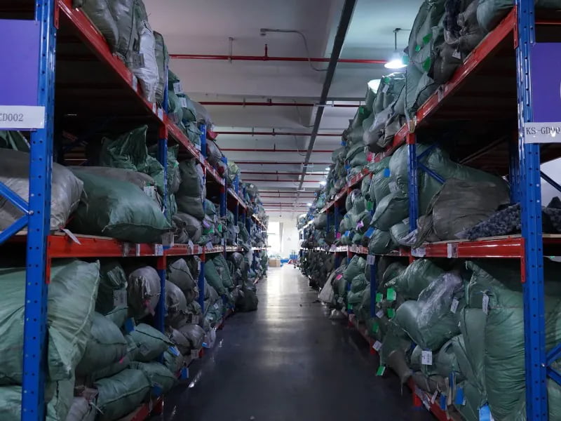 Soft pet goods inventory stored on warehouse racks