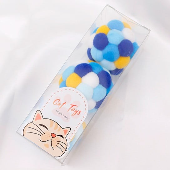 Pom-pom cat balls packed in a clear retail display box