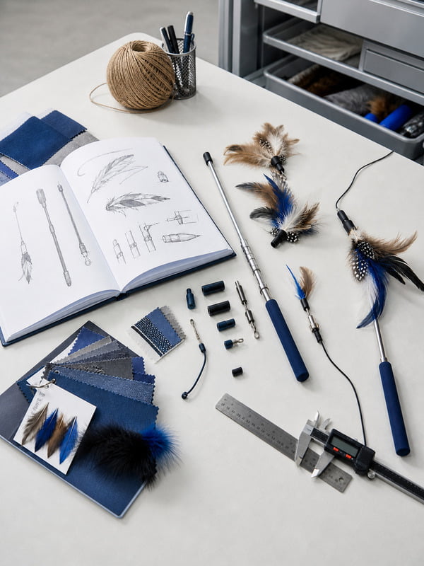 Custom interactive cat toy development with design sketches, materials, connectors, and assembled samples
