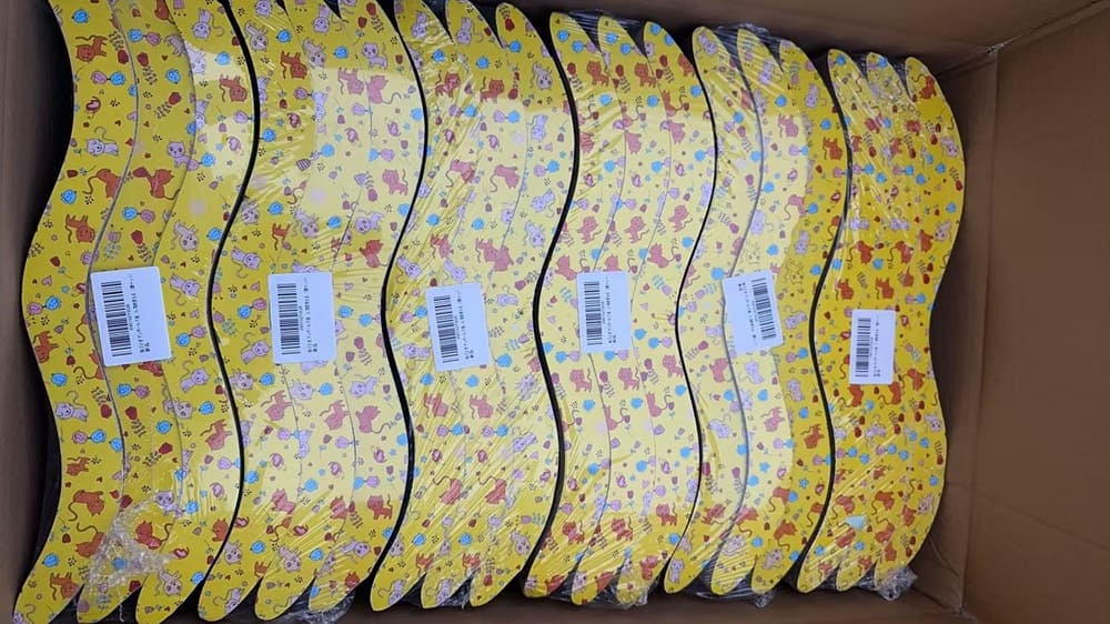 Finished printed corrugated cat scratchers packed inside a shipping carton