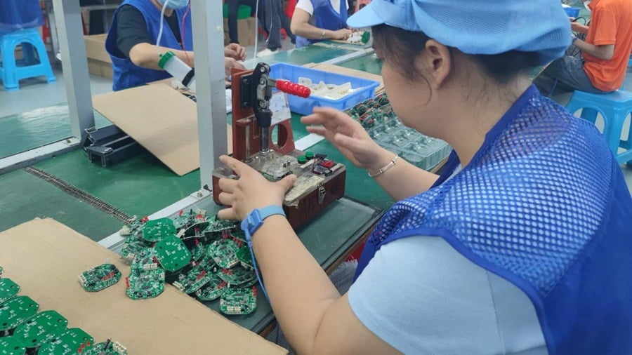 Automatic cat toy circuit boards being assembled on a production line