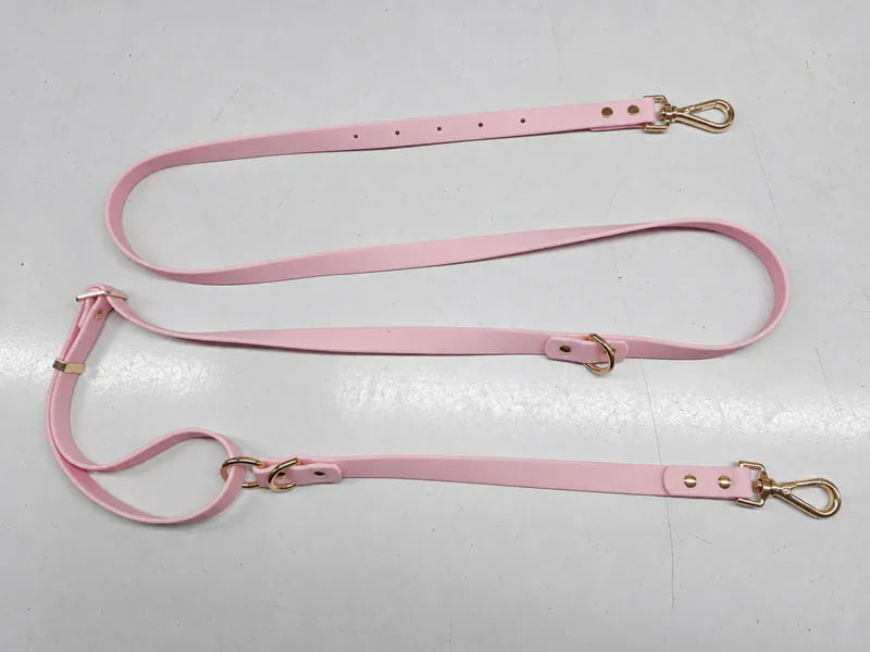 Pink adjustable dog leash illustrating construction options for custom designs, with two snap hooks and multiple attachment rings