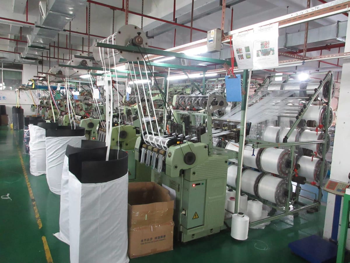 Looms weaving webbing for dog leashes in the factory