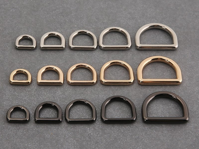 Metal D-rings in five sizes with silver-tone, gold-tone and dark finishes for dog walking sets.