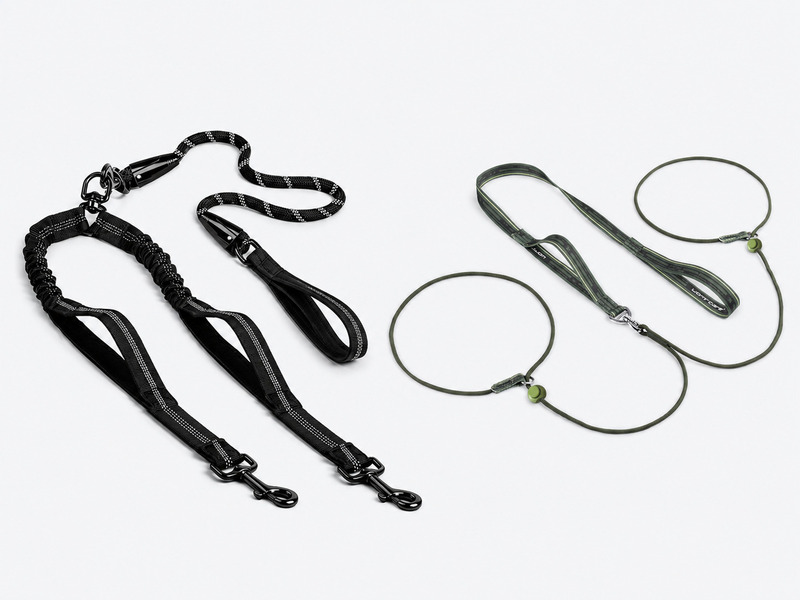 Black double-dog leash with two snap hooks and green twin-loop leash with adjustable loops