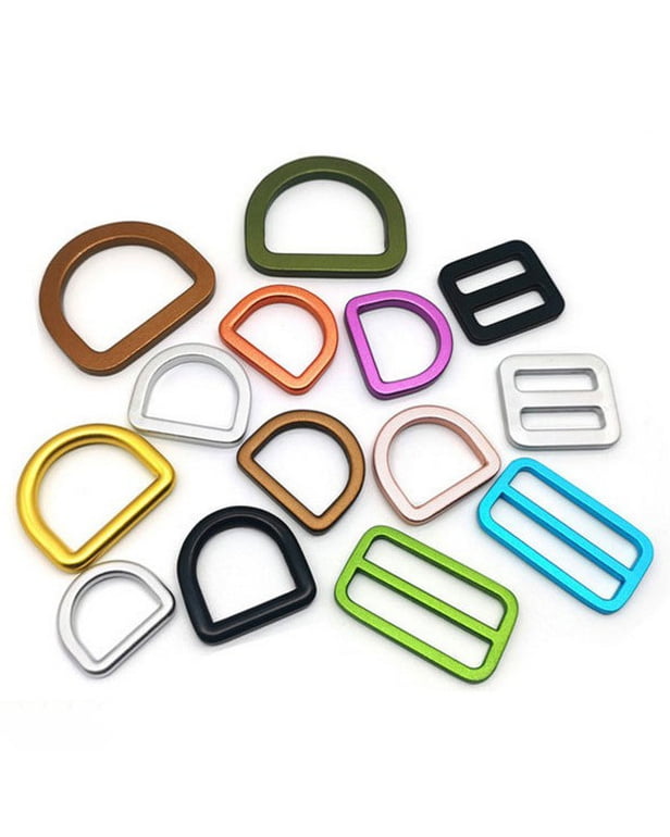 Metal D-rings and rectangular strap adjusters in assorted colors for pet harnesses.