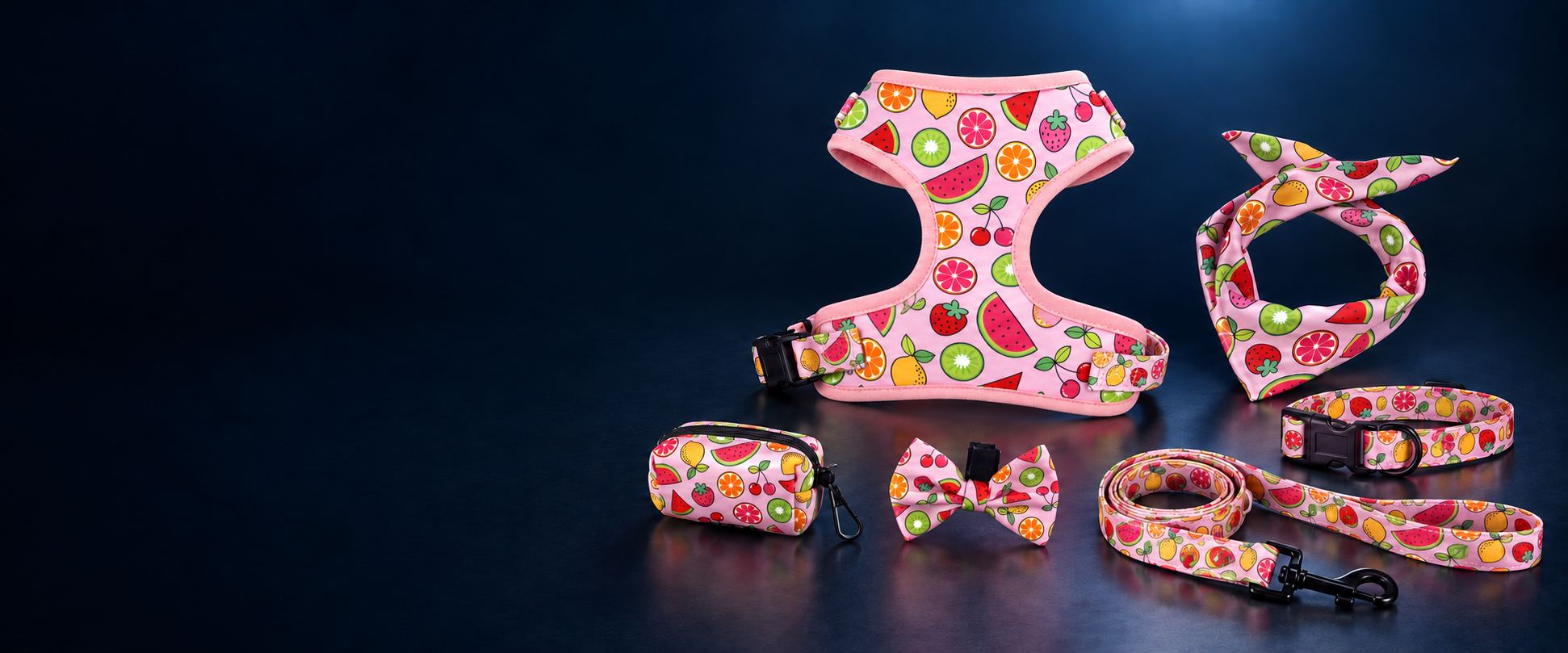 Fruit-print dog walking set with matching harness, collar, leash, bandana, bow tie and poop-bag holder.