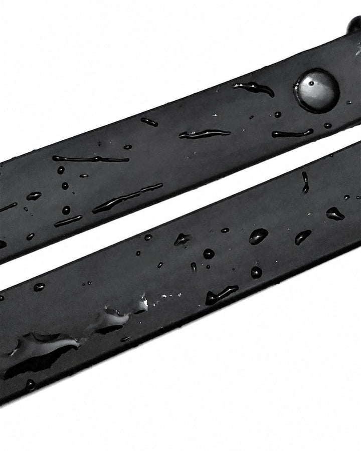 Black PVC-coated webbing for pet collars with water droplets on the surface
