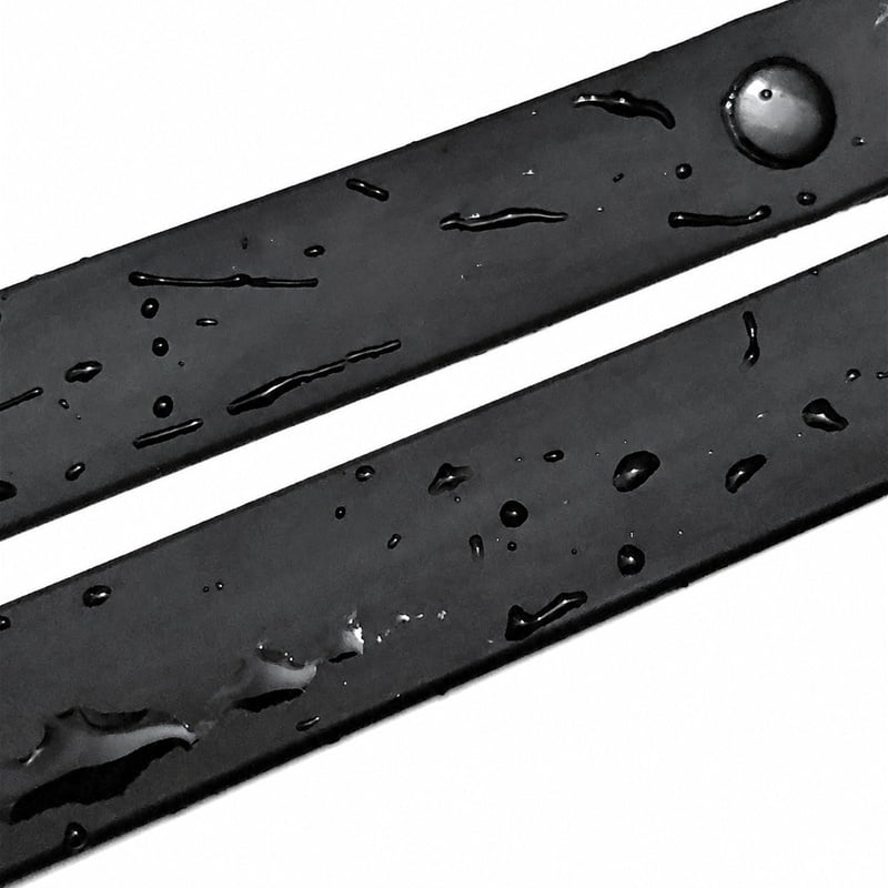 Black PVC-coated webbing strips with water droplets on their surface.