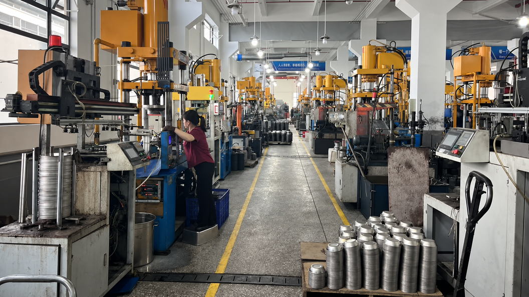 Stainless steel pet bowl production line with forming equipment and an operator