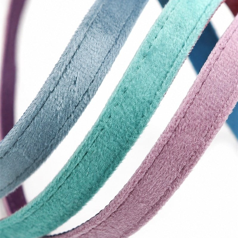 Blue, mint green and pink velvet straps showing pile texture and stitched edges.