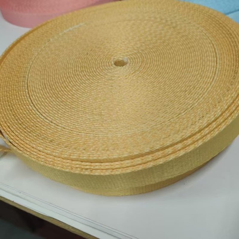 Yellow dog leash webbing roll showing the woven texture and strap edge.
